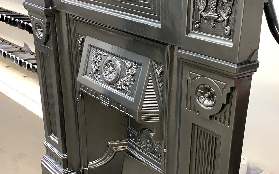 Old cast iron fireplace repaired & coated