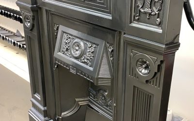 Old cast iron fireplace repaired & coated